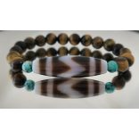 DZI Tigrisfog & Tigrisszem unisex karkötő – a valódi erő, siker és védelem szimbóluma