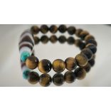 DZI Tigrisfog & Tigrisszem unisex karkötő – a valódi erő, siker és védelem szimbóluma